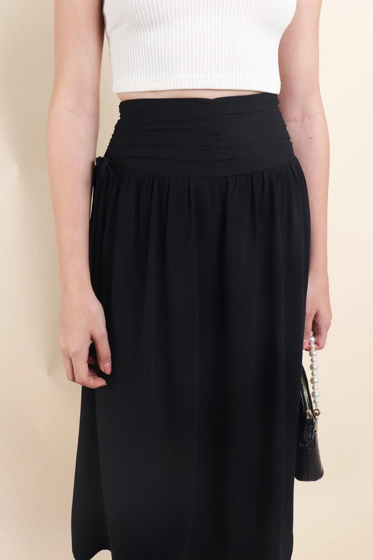 ADORA RUCHED MIDI SKIRT IN BLACK